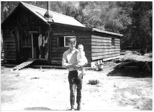 Bill Frew's Cabin in Coalmont from FB page Ron Mcallister in photo holding baby